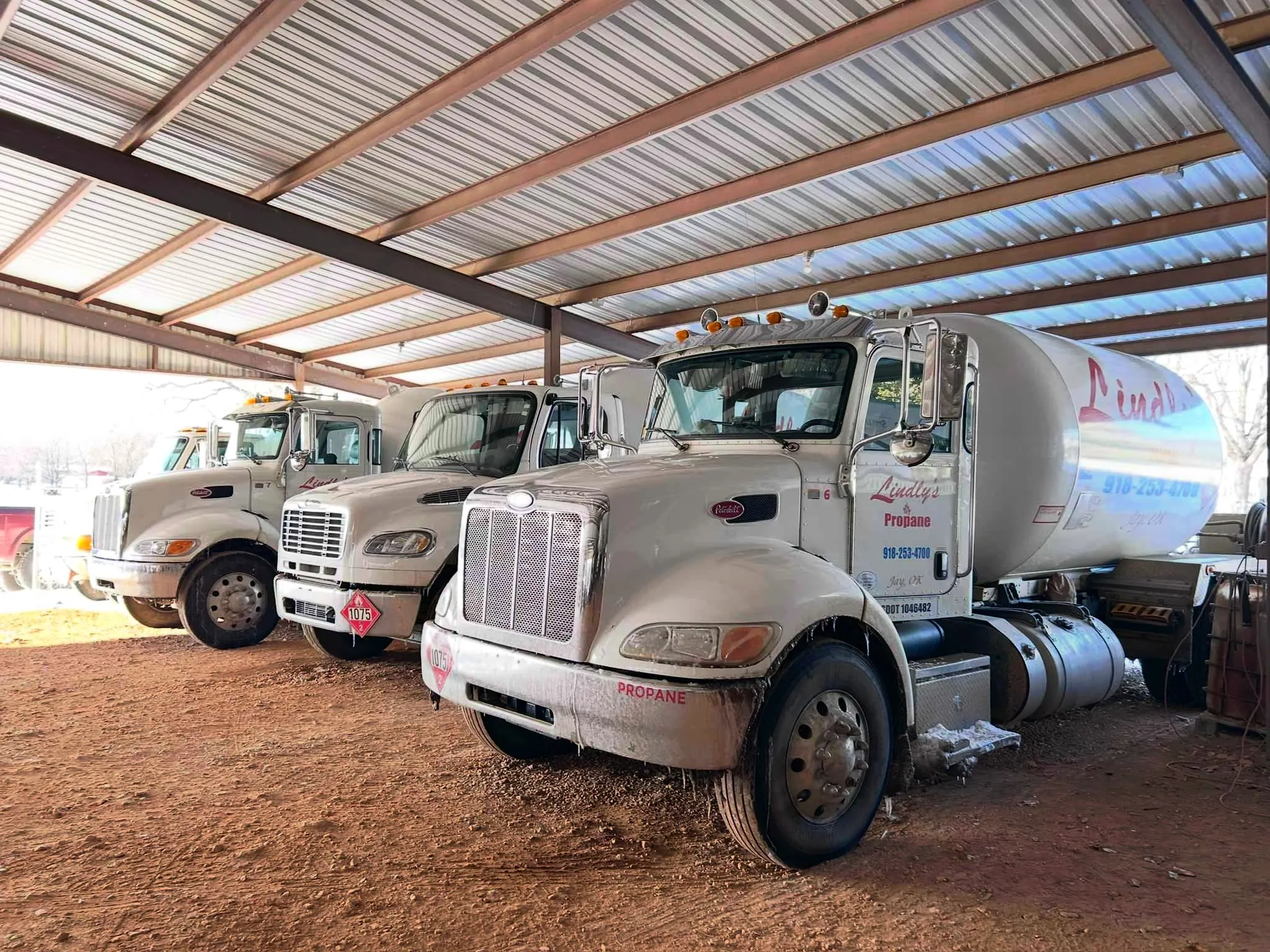 Lindly's Propane trucks carrying replacement parts and tanks